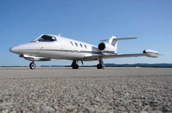 A white airplane on a runway
Description automatically generated with low confidence
